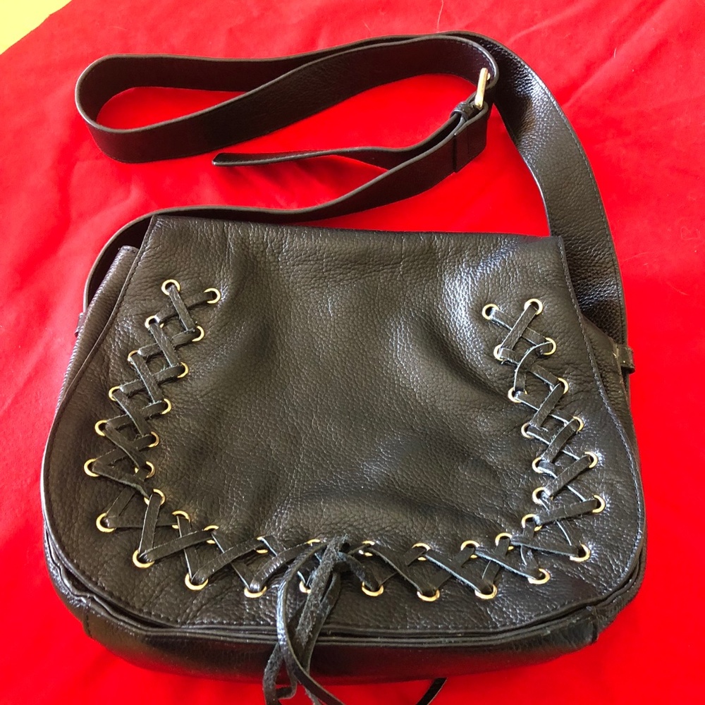 Ladies black leather handbag with laces.